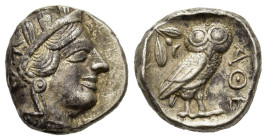 Attica, Athens, c. 454-404 BC. AR Tetradrachm (22,8 mm, 17,8 g). Helmeted head of Athena r. R/ Owl standing r., head facing; behind, olive spray and c...