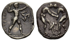 Pamphylia, Aspendos, c. 380-325. AR Stater (20 mm, 10,65 g). Two wrestlers grappling; between, BΛ . R/ Slinger in throwing stance r.; in r. field, tri...