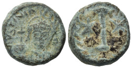 Justinian I (527-565). Æ 10 Nummi (15,80 mm ,5,55 g). Rome or Ravenna, AD 547-549. Helmeted and cuirassed facing bust, holding globus cruciger and shi...