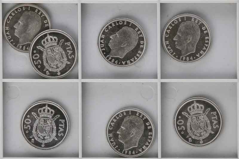 Lote 7 monedas 50 Pesetas. 1984. M coronada. SC.