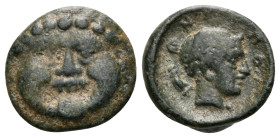 MACEDON. Neapolis. Circa 424-350 BC. Chalkous (Bronze, 11 mm, 1.01 g, 1 h). Facing gorgoneion with protruding tongue. Rev. NEOΠO Head of nymph to righ...
