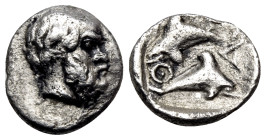 ISLANDS OFF THRACE, Thasos. Circa 412-404 BC. Hemiobol (Silver, 7.5 mm, 0.43 g). Head of bald and bearded Selinos to right. Rev. Θ-Α-Σ-I Two dolphins,...