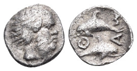 ISLANDS OFF THRACE, Thasos. Circa 411-404 BC. Hemiobol (Silver, 9 mm, 0.40 g, 8 h). Half-bald and bearded head of a satyr to right. Rev. Θ-Α-Σ-I Two d...