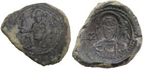 Messina. Ruggero II (1105-1154). Doppio follaro concavo, 1112-1130. D/ Ruggero seduto in trono, tiene con la destra lunga asta terminante in croce e c...