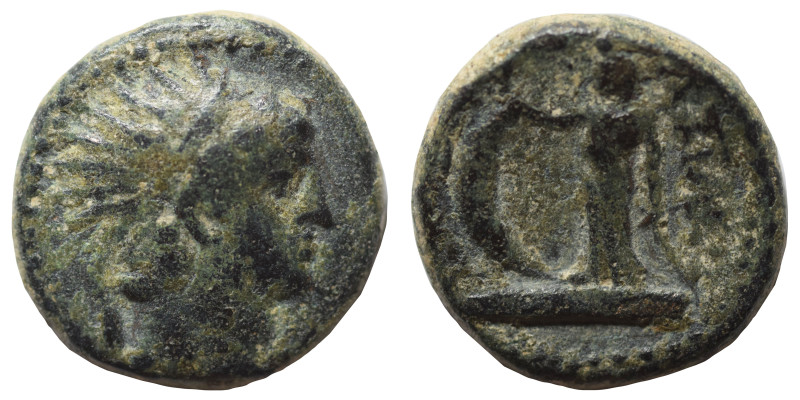 Greek. Ae (bronze, 5.56 g, 17 mm). Radiate bust to left. Rev. Victory standing l...