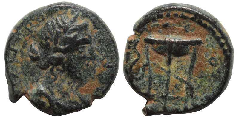 Uncertain. Ae (bronze, 1.71 g, 13 mm). Artemis (?) left. Rev Tripod, legend arou...