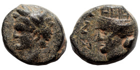 SYRIA, Decapolis. Canata. Domitian, 81-96. (bronze, 2.27 g, 12 mm). ΔOMITI KAICAP Laureate head of Domitian to left. Rev. KANATA / ZNP Turreted and dr...
