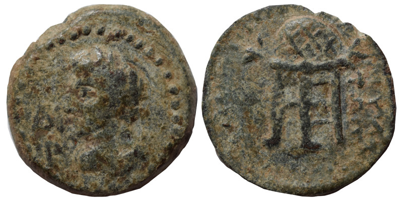 Uncertain. Ae (bronze, 2.41 g, 16 mm). Female bust left. Rev. Tripod, traces of ...