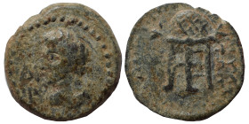 Uncertain. Ae (bronze, 2.41 g, 16 mm). Female bust left. Rev. Tripod, traces of legend. Fine.