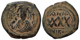 Phocas, 602-610. Follis (bronze, 11.57 g, 30 mm), Nicomedia. δ N FOCAS PER AVς (or similar) Crowned bust of Phocas facing, wearing consular robes, hol...