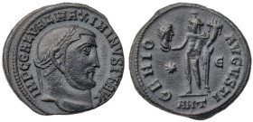 Maximinus II. Æ Follis (4.1 gr.), AD 310-313. Antioch, 1st officina, sruck AD 312. Laureate head right / Genius standing left, holding head of Sol and...