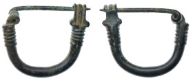Greek Fibula. Bronze Æ (24.1 gr.), 5th-1st Century BC. A fibula comprising a balustered bow with trapezoidal catchplate to one end with pellet detaili...