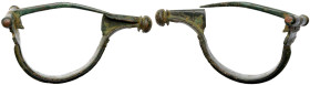 Greek Fibula. Bronze Æ (15.7 gr.), 5th-1st Century BC. A fibula configured in an oval shape, with pin intact.

Very Fine.
