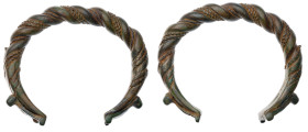 Roman Twisted Bracelet. Bronze Æ (weight), 1st - 5th Century AD. A large bronze twisted penannular bracelet.

Very Fine.