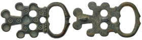 Byzantine Belt Plate. Bronze Æ (22.4 gr.), 9th Century AD. A belt buckle with elongated M-shaped frame; incised circles and other detailing, lugs to r...