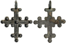 Byzantine Cross Pendant. Bronze Æ (7.9 gr.), 9th Century AD. A large bronze cross pendant with scattered circular designs; loop intact.

Very Fine.