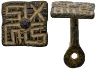 Islamic Stamp Seal. Bronze Æ (6 gr.), 16th-19th Century AD. Seal with handle. On square face: swastik symbol.

Very Fine.