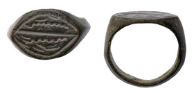Islamic Ring. Bronze Æ (5.4 gr.), 16th-19th century AD. Face with incised design.

Intact with a brown patina. Very Fine.