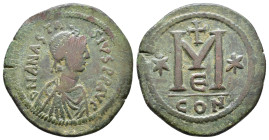 Anastasius I. 491-518. Æ Follis Constantinople mint, 5th officina. Struck 507-512. Pearl-diademed, draped, and cuirassed bust right / Large M; cross a...