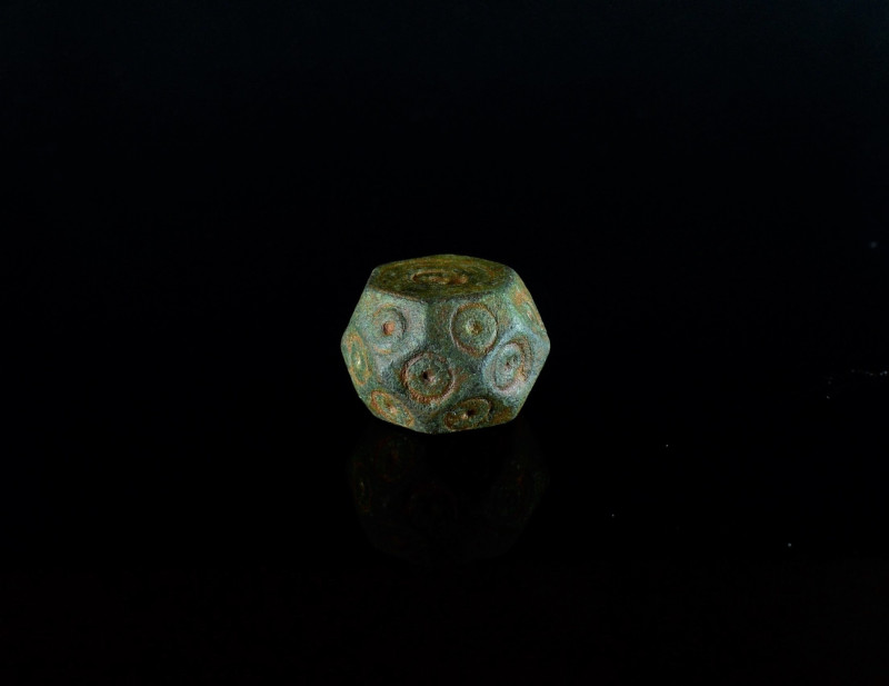 Islamic Facetted Trade Weight. 8th-10th century AD. A polyhedral bronze trade we...