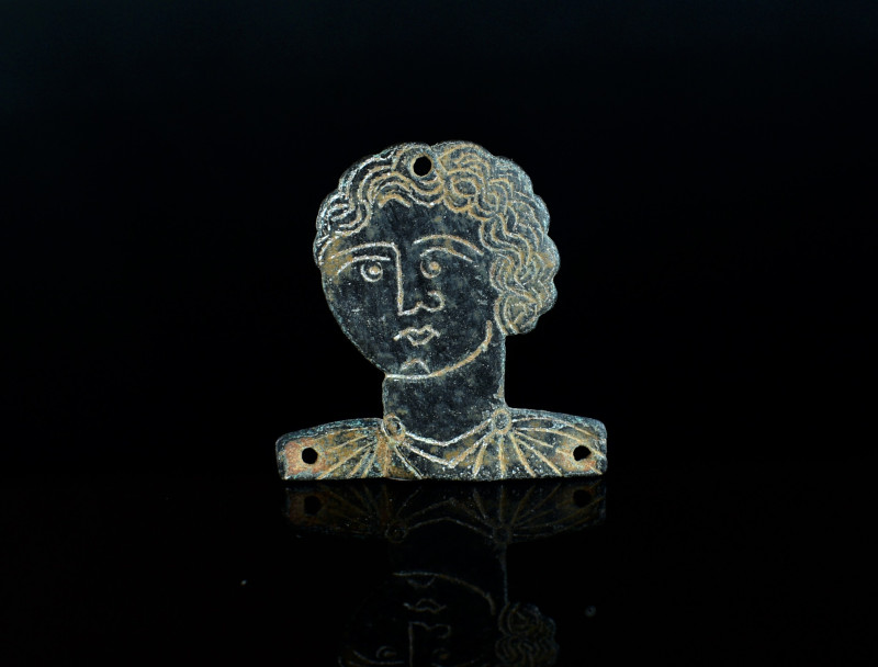 Roman bronze appliqué. Ca. 2nd century AD. Head of a young boy. Beatiful. 2,03g,...