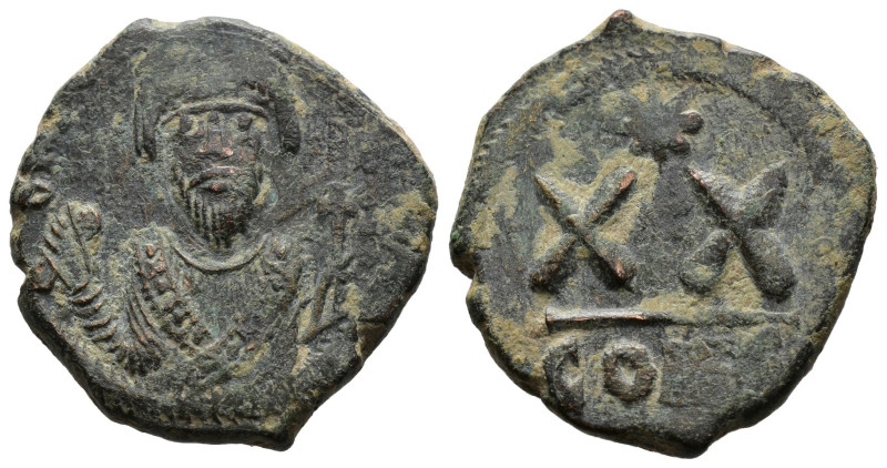 PHOCAS (602-610) AE Half Follis. Constantinople. 
 Crowned bust facing, wearing ...