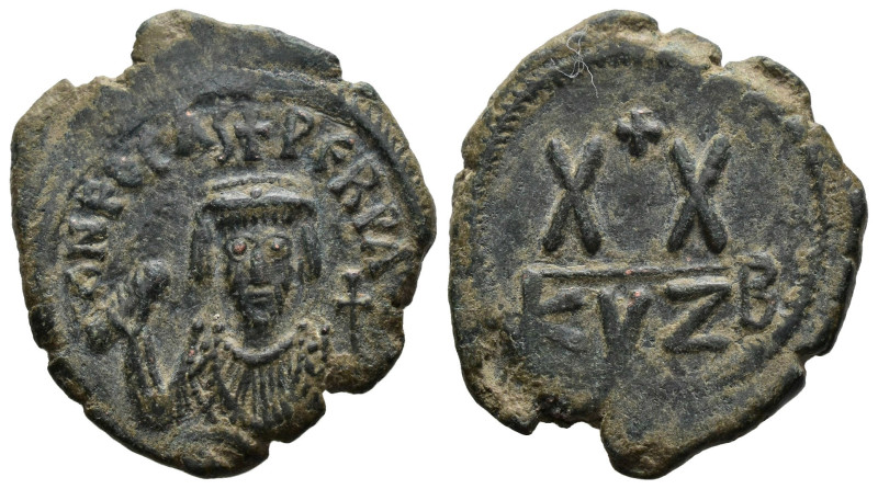 Phocas. AD 602-610. Cyzicus Follis AE. 
 crowned bust facing, wearing consular r...