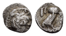ATTICA. Athens.(Circa 454-404 BC).Obol.

Obv: Helmeted head of Athena right.

Rev: AΘE.
Owl standing right, head facing; olive sprig and crescent to l...