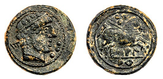 EKUALAKOS. Mitad. A/ Cabeza masculina a der., delante tres glóbulos, detrás, sig...