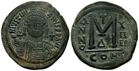 Justinian I. Follis (40 Nummi). 527-565 AD. Constantinople. (Sear-163). Anv.: D N IVSTINI-ANVS P P AVC. Bust with helmet, diadem, armour, cross globe ...