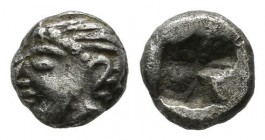 Ionia, Kolophon. Circa 550-500 BC. AR Hemiobol (6mm, 0.44g). Archaic head of Apollo left / Quadripartite incuse square punch.