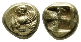 Mysia, Kyzikos. Circa 550-500 BC. EL Hekte (10mm, 2.76g). Upper body of winged female deity to left, holding tunny fish in right hand, raising a flowe...