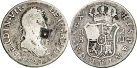 Cuba. (1841). Contramarca de Vique (Cuba) (De Mey 481), sobre 2 reales de Fernando VII, Sevilla 1820 CJ. Curiosa estampación, con el cuadrado central ...