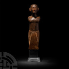 Large Egyptian Wooden Dignitary Figure
New Kingdom, 1550-1070 B.C. A finely modelled wooden figure of a high official carved in the round, standing f...