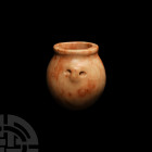 Egyptian Pink Stone Kohl Pot
Late Predynastic-Early Dynastic Period, 3100-2850 B.C. A pink marble or alabaster kohl pot of fusiform shape, two horizo...