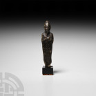 Egyptian Black Stone Osiris Statuette
Late Period, 664-332 B.C. A black stone figure of Osiris wearing the White Crown of Upper Egypt, with remains o...
