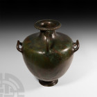 Large Greek Decorated Bronze Hydria
Early 5th century B.C. A bronze hydria composed of a tapering body, broad shoulder and waisted neck, the everted ...
