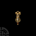 Hellenistic Gold pendant with Supporting Dolphins
2nd-1st century B.C. An amphora-shaped pendant composed of a piriform glass body with ribbing, carn...