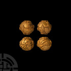 Greek Gold Filigree Bead Collection
Circa 4th century B.C. A group of four spherical gold beads, each adorned in filigree with spirals and granulated...