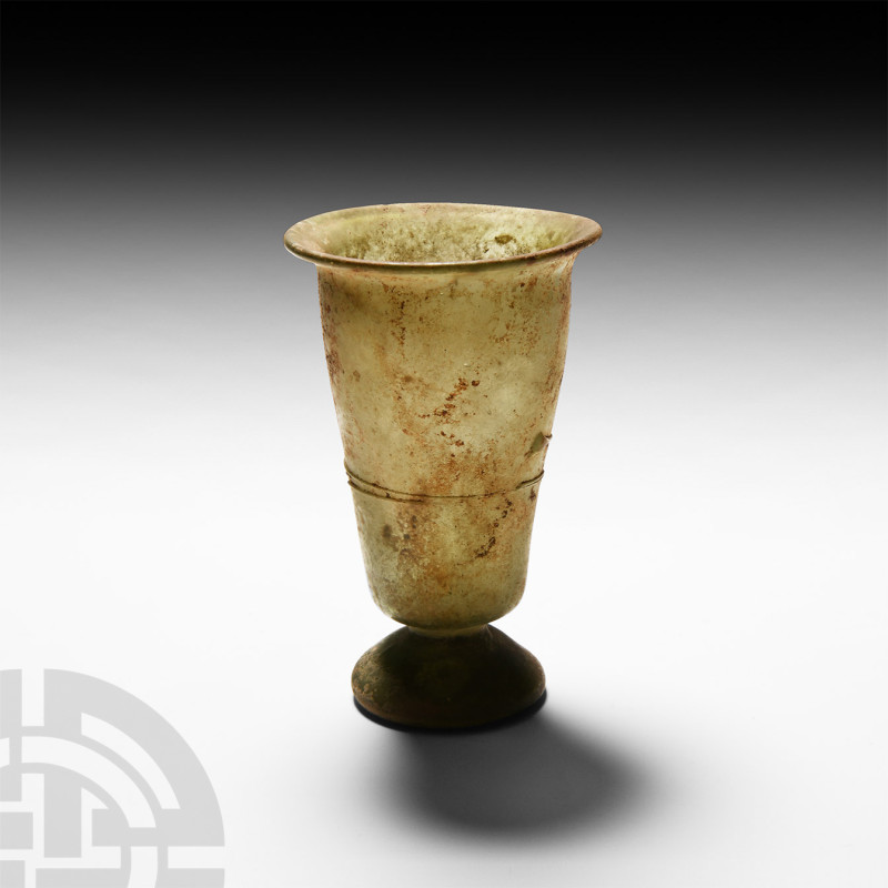 Roman Glass Footed Beaker with Trail
4th-5th century A.D. A green glass beaker ...