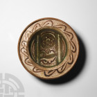 Byzantine Green and Brown Glazed Bowl
Circa 15th century A.D. A ceramic bowl with a shallow body and broad flange rim with raised lip, geometric sche...