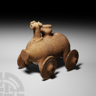 Large Western Asiatic Bull Rhyton with Wheels
Late 2nd-1st millennium B.C. A roughly capsule-shaped ceramic rhyton formed as a bull or ram with four ...