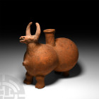 Large Western Asiatic Bull Rhyton
1st millennium B.C. A tauriform vessel composed of a waisted capsule-shaped body on four short legs with cloven hoo...
