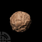 Sumerian Clay Bulla Envelope Containing Tokens
Uruk Period, circa 5500-3500 B.C. A rare spherical ceramic bulla envelope containing clay tokens, the ...