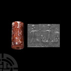 Neo-Assyrian Carnelian Cylinder Seal with Presentation Scene
1st millennium A.D. or earlier. A carnelian cylinder seal bearing a scene composed of tw...