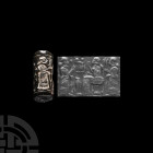 Western Asiatic Green Stone Cylinder Seal with Presentation Scene
21st century B.C. A dark green jasper cylinder seal with a seated figure of crowned...