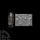 Neo-Assyrian Black Jasper Cylinder Seal with Cultic Banquet Scene
Early 1st millennium B.C. A black jasper cylinder seal engraved with a cultic banqu...