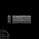 Large Akkadian Cylinder Seal with Double Register
2nd millennium B.C. A finely-carved cylinder seal of diorite, drilled for suspension; frieze in two...