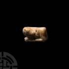 Sumerian Amuletic Calf Figurine
3rd-2nd millennium B.C. A composition amuletic figurine of a calf with legs folded and bound beneath the body, head t...