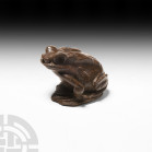 Western Asiatic Hardstone Frog
2nd-3rd century A.D. or later. A carved hardstone amulet in the form of a frog sitting on a base, modelled with large ...